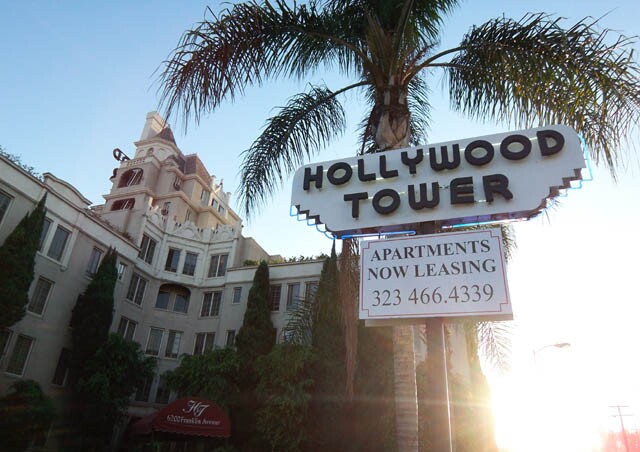 Front of Hollywood Tower apartment building with sign
