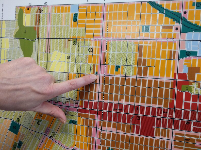 LA's principal planner Shana Bonstin points out the corner of Western and 6th St on the zoning map for Wilshire/Koreatown. The map was made in 2001, but the area has already gone through dramatic population changes since that time.