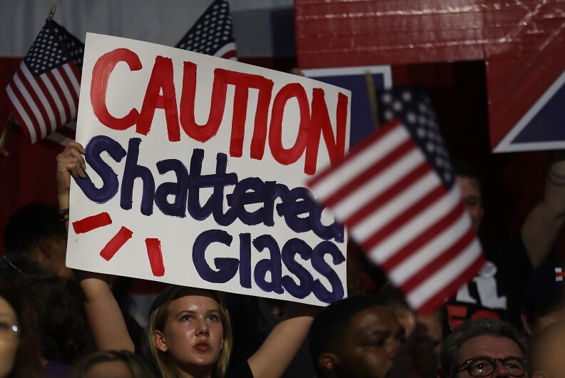 A supporter of democratic presidential candidate former Secretary of State Hillary Clinton holds a sign during a primary night event on June 7, 2016 in Brooklyn, New York. Six states will vote in presidential primaries a day after the Associated Press declared that Hillary Clinton has enough delegates to become the presumptive democratic nominee.