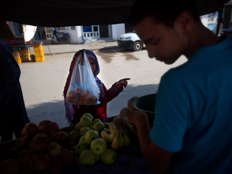 A vendor sells fruit at the Sidi Bouzid market where fruit-seller Mohammed Bouazizi worked.