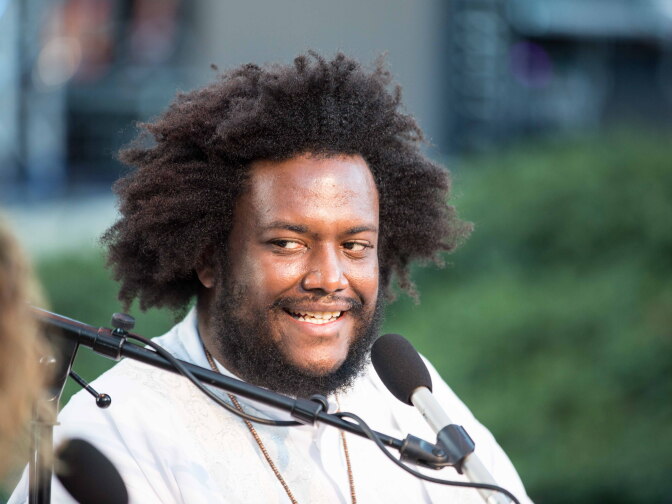 Jazz musician, Kamasi Washington in conversation with Alex Cohen as part of Grand Performances' "Aftershocks" series on the Watts riots 