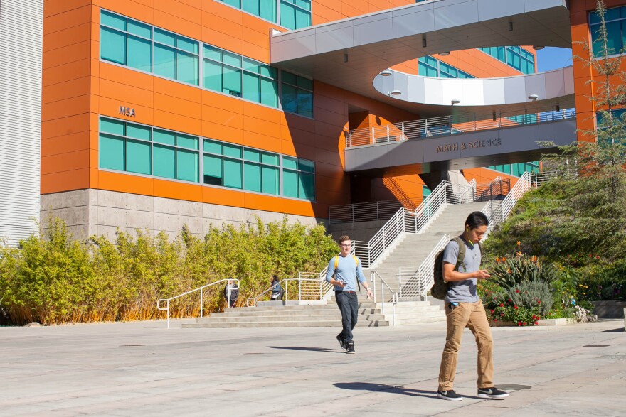 File: Students walk on campus at West Los Angeles College in Los Angeles on Thursday, Nov. 3, 2016.