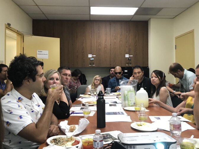 About 30 pastors and their spouses crowd into the offices of the interfaith group Clergy & Laity United for Economic Justice for an immigration workshop.