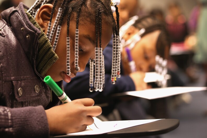 NEW YORK, NY - MAY 06:  A 2nd grade student draws about hopes for her future during an immigration workshop at the Museum of Tolerance on May 6, 2013 in New York City. Some eighty 2nd and 3rd graders, many of whom are immigrants or children of immigrants, participated in the event. The workshop was designed to help children understand the challenges faced by immigrants in their home countries, their often difficult journeys to the United States and the tough adjustment to their new surroundings. It was led by guidance counselor Karina Medina, who just published "Old Home New Home" about a child immigrant's experience coming to New York City.  (Photo by John Moore/Getty Images)