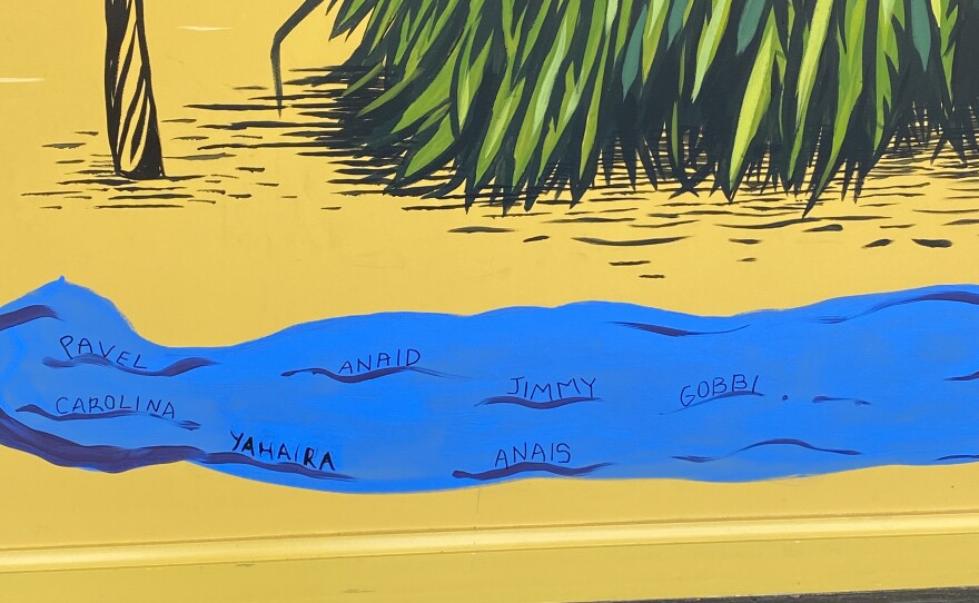 Another close up of the mural reveals student names written on the blue water. 