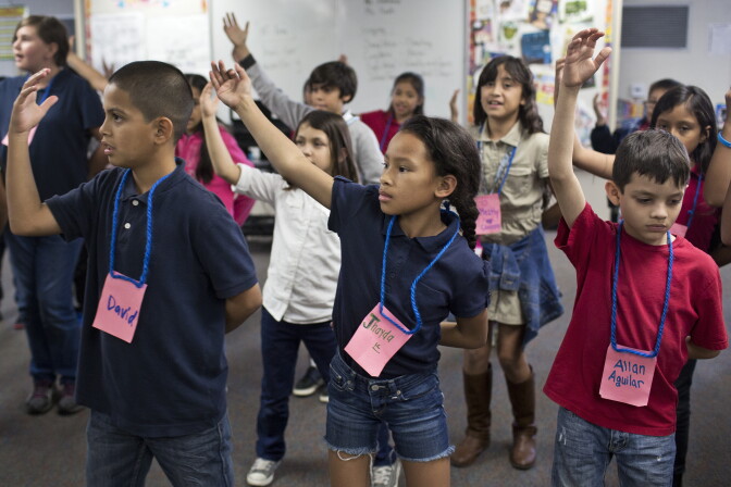 Students at Adelaide Price Elementary School practice choreography for "Arabian Nights," the opening song to the play.