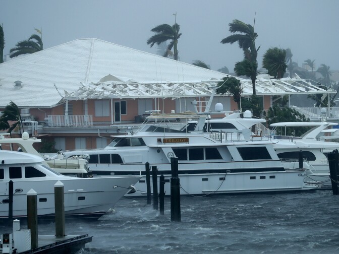 FORT LAUDERDALE, FL - SEPTEMBER 10:  Shredded awning whips in tropical storm winds at the Coral Ridge Yacht Club as Hurricane Irma hits the southern part of the state September 10, 2017 in Fort Lauderdale, Florida. The powerful hurricane made landfall in the United States in the Florida Keys at 9:10 a.m. after raking across the north coast of Cuba.  (Photo by Chip Somodevilla/Getty Images)