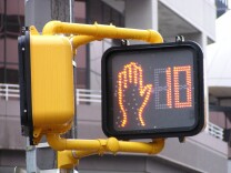 FILE: The California legislature has voted to change a law that makes it illegal for pedestrians to enter a crosswalk once the countdown timer has begun.