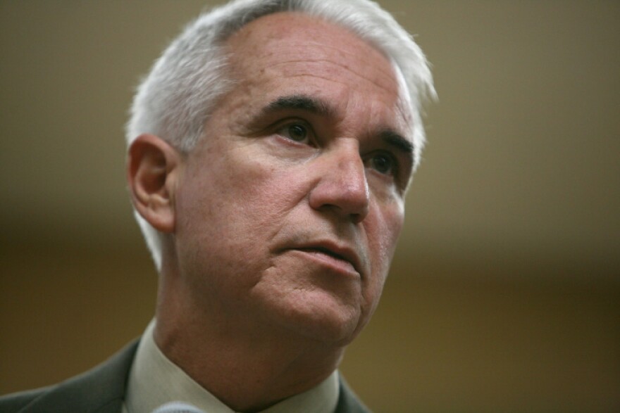 An close-up image of white-haired L.A. District Attorney George Gascón