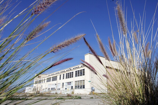 Old jet hangers are seen at the former El Toro Marine Corps Air Station in Irvine, Calif. The base was designated a Superfund hazardous waste site in 1990. After a major cleanup effort to mitigate groundwater and soil contamination, much of the base was removed from the Superfund list in 2014. 