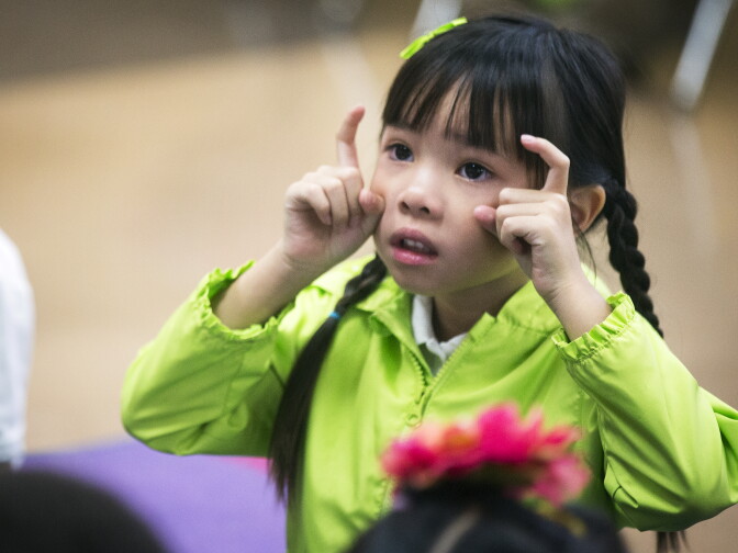 Kindergartener Kayla Nguyen sings a song with her class at Willard Elementary School in Pasadena, two weeks into the school year, on Wednesday morning, Aug. 31, 2016.