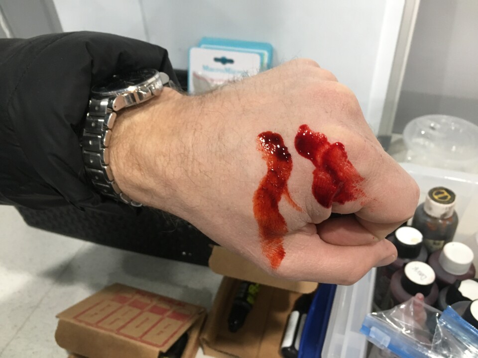 Christien Tinsley testing out different shades of blood on his hand. 