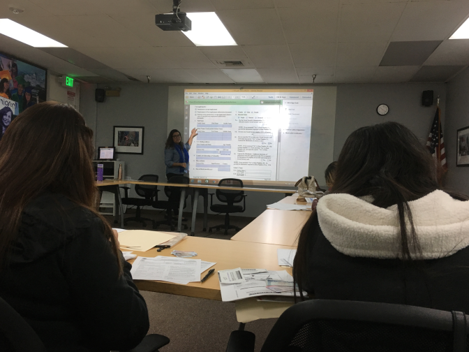Karla Cortez, an accredited legal representative for the Coalition for Humane Immigrant Rights of Los Angeles, walks young immigrants through the renewal process for Deferred Action for Childhood Arrivals. President Trump rescinded the DACA program in September, but a federal judge last week ruled that the government must accept renewal applications. 