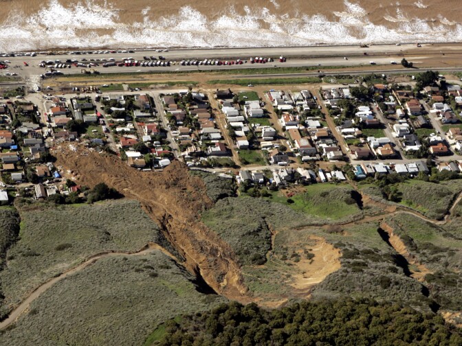 The scene of a large mudslide that on Monday, Jan. 10, 2005, resulted in the deaths of 10 people and the loss of more than a dozen homes, in the coastal community of La Conchito, Calif., is shown Tuesday, Jan. 11, 2005. The community suffered a similar mudslide, killing residents and destroying homes, in 1995. Despite the dangers of living in scenic splendor atop hills or on their slopes, many California homeowners are willing to live with the risks from natural disasters. 