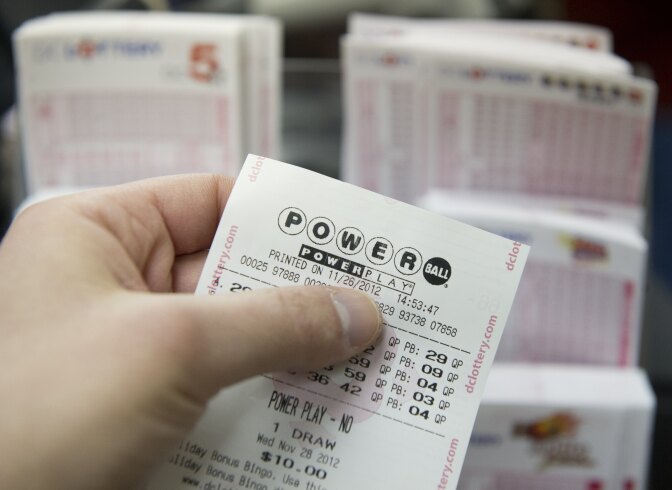 A Powerball lottery ticket for the estimated record 425 million USD jackpot prize, Powerball's biggest winnings ever, is seen in a convenience store in Washington on November 26, 2012. The previous drawing resulted in no winner, setting up for the record setting prize when numbers will be drawn on Wednesday. Tickets are sold in 42 US states, Washington, DC, and the US Virgin Islands.