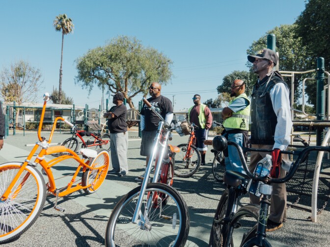 Los Riders and East Side Riders Bike Club stop by during the Mission Continues playground beautification project at Gonzaque Village in Watts.