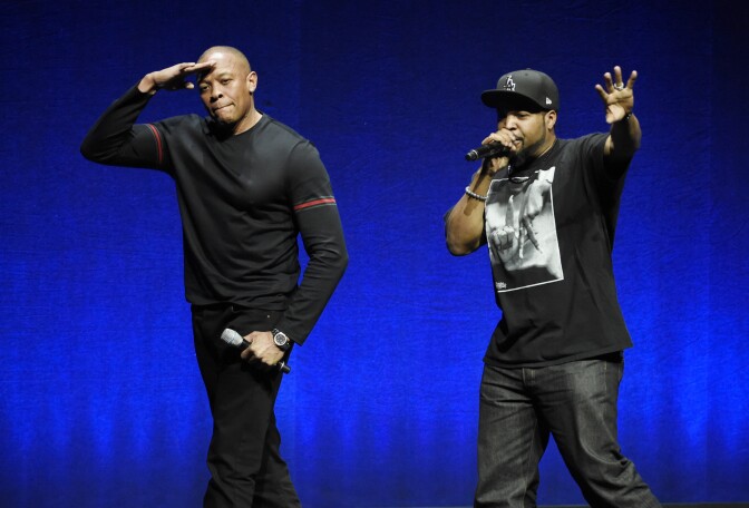N.W.A. members Dr. Dre, left, and Ice Cube, two of the subjects of the upcoming biographical drama "Straight Outta Compton," salute the crowd after speaking at the Universal Pictures presentation during CinemaCon 2015 at Caesars Palace on Thursday, April 23, 2015, in Las Vegas. (Photo by Chris Pizzello/Invision/AP)