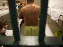 A prisoner in Men's Central Jail in downtown Los Angeles speaks with his cellmates in this photo from December 2011.