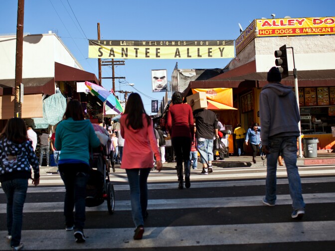 Shoppers fill Santee Alley on Christmas Eve for last-minute gift buying. Whole Foods, Toys R Us, Target, and other stores were also open on Dec. 24 for last-minute shoppers.