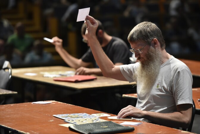 New Zealand's Nigel Richards competes in a category of the Francophone Scrabble World Championships in Louvain-La-Neuve on July 21, 2015.  Nigel Richards, a 48-year-old New Zealander who was crowned the champion of Francophone Scrabble on July 20, doesn't speak a word of French. Bushy-bearded, bespectacled Richards is already a celebrity in the English version of Scrabble, winning its world championship in 2007 and again in 2011.  AFP PHOTO / JOHN THYS        (Photo credit should read JOHN THYS/AFP/Getty Images)