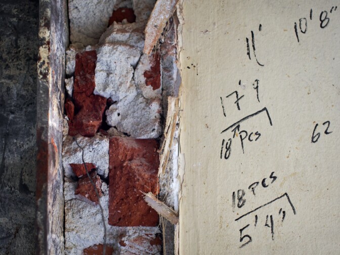 Measurements are written on the walls inside an under-construction apartment unit. Westport Construction will add a kitchenette to every unit in the building.