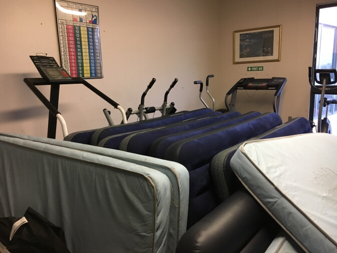 What's normally an exercise room for staffers at Union Rescue Mission in downtown L.A. is now a storage area for air mattresses and cots that are used by the influx of homeless families seeking shelter.