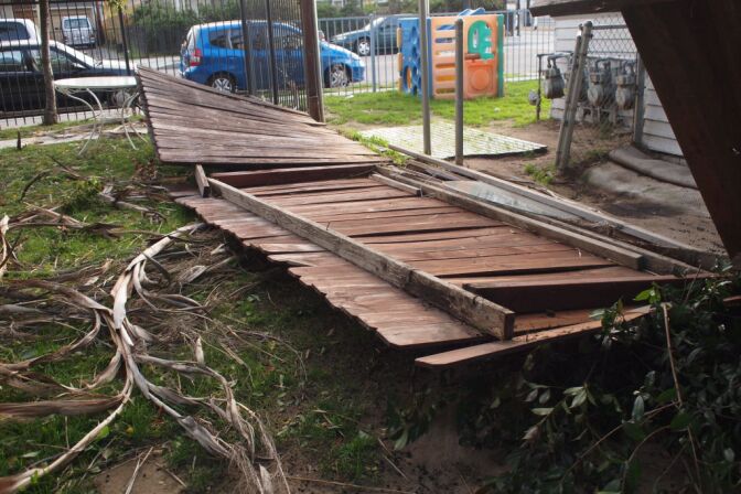 A fence in Highland Park taken down during Wednesday night's winds.