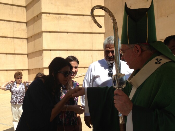 L.A. Archbishop Jose Gomez greets congregants after mass September 8, 2013.