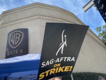 A sign reads SAG-AFTRA on Strike! 
