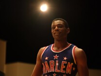 A film still of 'Sweetwater' star Everett Osborne in a Harlem Globetrotter jersey. 