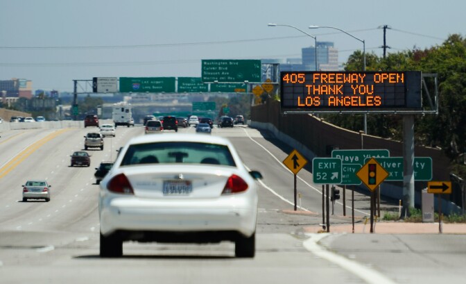 LOS ANGELES, CA - JULY 17: A freeway trafiic sign announces the opening of the Interstate 405 and thanks motorists after the freeway re-opened ahead of schedule following the 10 mile shutdown of the nation's busiest freeway for bridge work on July 17, 2011 in Los Angeles, California. Los Angeles city officials advised residents to stay home or stay away from the area over the weekend fearing massive traffic jams of what has become known as ''Carmageddon.'' which never materialized. (Photo by Kevork Djansezian/Getty Images)