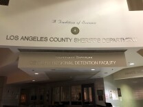 Photo of a building name posted on a wall.