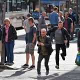 EDINBURGH, SCOTLAND - JULY 13:  Actors Ewan McGregor and Ewan Bremner run on the set of the Trainspotting film sequel on Princess Street on July 13, 2016 in Edinburgh, Scotland. The long awaited Trainspotting 2 is being filmed in Edinburgh and Glasgow, 20 years after the original was released and it will also see the cast from the first film returning including Ewan McGregor, Jonny Lee Miller and Robert Carlyle.  (Photo by Jeff J Mitchell/Getty Images)