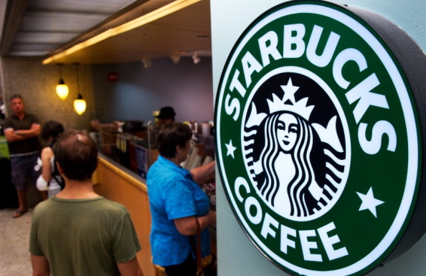 Starbucks and Square are teaming up to let customers pay without ever opening a wallet.