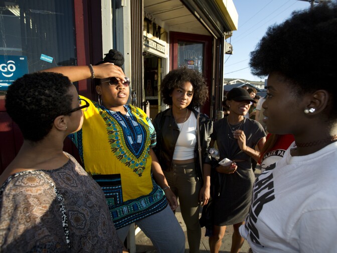 Nyallah Noah, USC student (yellow top) waits in line outside the Black Lives Matter LA performance art show at The Underground Museum Washington Boulevard in Los Angeles on July 8th, 2016.