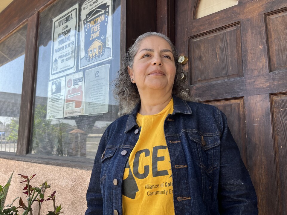 Cristina Campos stands outside her South L.A. apartment.