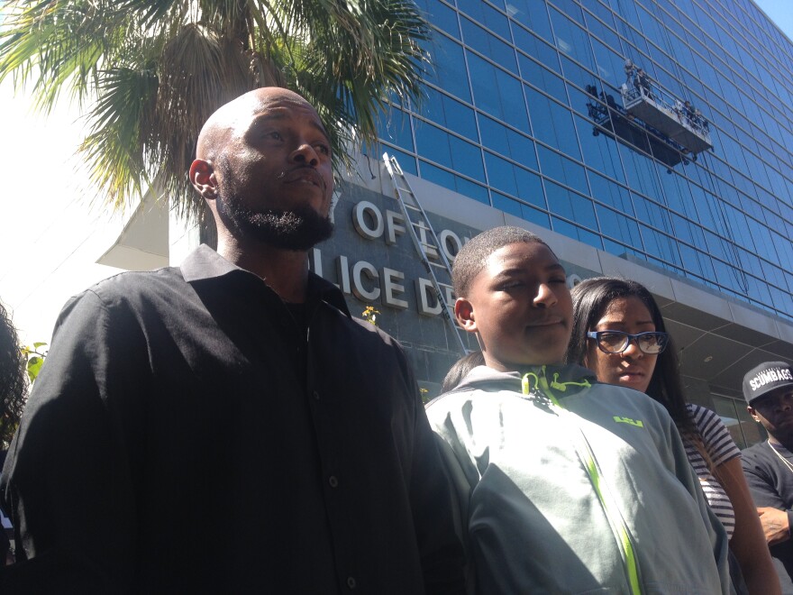 Trevor Woods (left) talks about his brother Tyler Woods, 19, who was shot and killed by Long Beach police after a foot pursuit. They were at a news conference announcing the filing of a claim against the city on April 14, 2014.