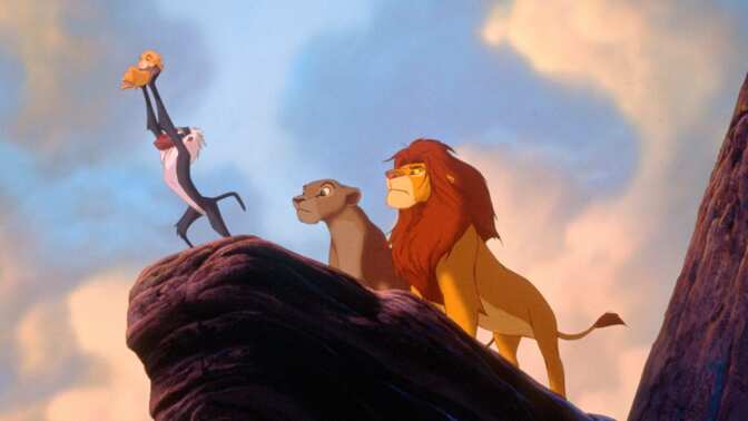 From the 1994 movie 'The Lion King.' Rafiki holds up small cub Simba while Mufasa and Sarabi stand behind them.