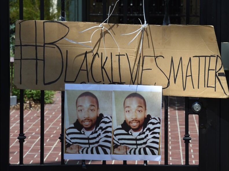 A protest sign showing and image of Ezell Ford as members of the 'Black Lives Matter' alliance stage protest outside the Los Angeles Mayor Eric Garcetti's home as they try to force him to fire LAPD Police Chief Charlie Beck, in Los Angeles, California on June 7, 2015. The alliance have renewed protests after a recent report from an LAPD watchdog determined that the August 11, 2014 officer-involved shooting death of 25-year-old Ezell Ford in South Central was justified.        AFP PHOTO/ MARK RALSTON        (Photo credit should read MARK RALSTON/AFP/Getty Images)