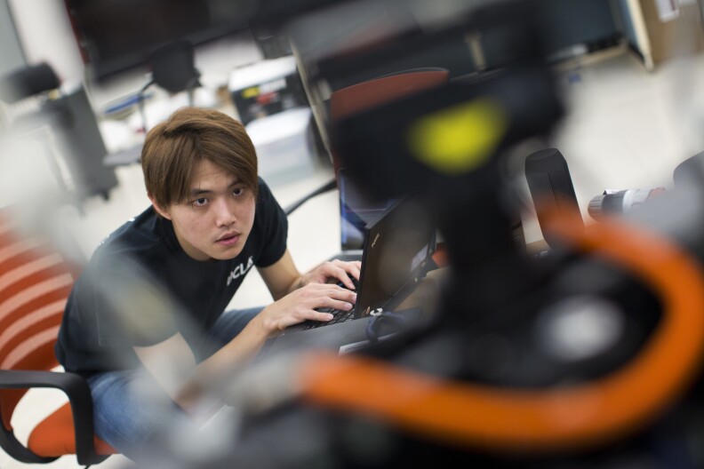Min Sung Ahn starts grad school this fall in mechanical engineering at UCLA. Ahn works with THOR from his laptop on Friday, May 8, 2015 inside the Robotics and Mechanisms Laboratory.