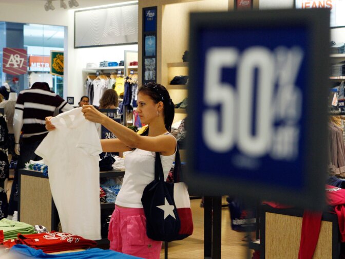 A shopper browses clothing at an Aeropostale store in Paramus, N.J.  For retailers, the back-to-school shopping season is the second most important of the year, after Christmas.