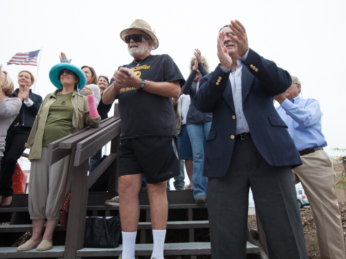 Environmental activists hug at a press conference outside of the San Onofre nuclear plant on June 7th, 2013. Edison announced that the plant will be shut down permanently.