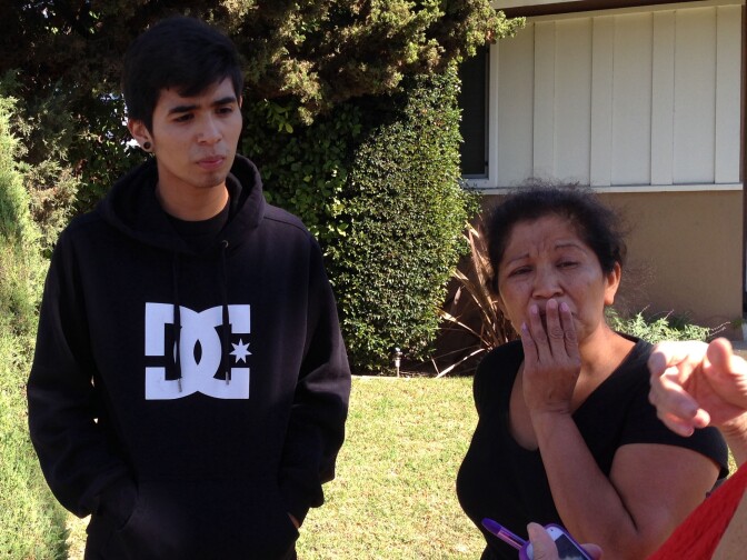 Josafat Gonzalez, left, brother of Andrea Gonzalez, speaks with reporters on Sunday, November 2, 2014. 