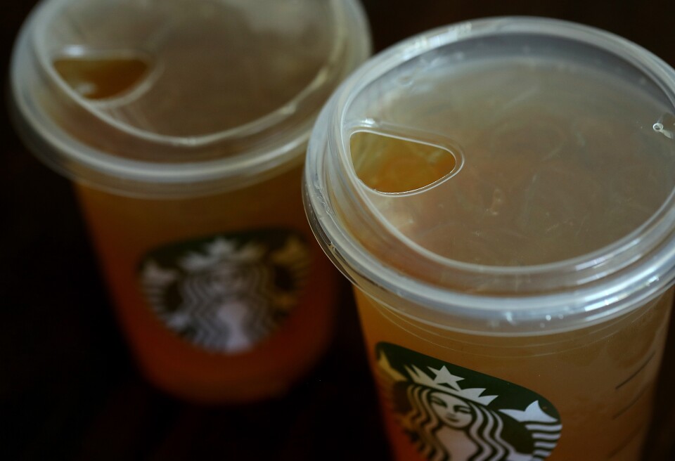 SAUSALITO, CA - JULY 09:  A new flat plastic lid that does not need a straw is shown on a cup of Starbucks iced tea on July 9, 2018 in Sausalito, California. Starbucks announced today that it plans on phasing out all plastic straws from its 28,000 stores worldwide by 2020. Some of its drinnk cups will be fitted with special flat plastic lids that can be used without straws.  (Photo by Justin Sullivan/Getty Images)