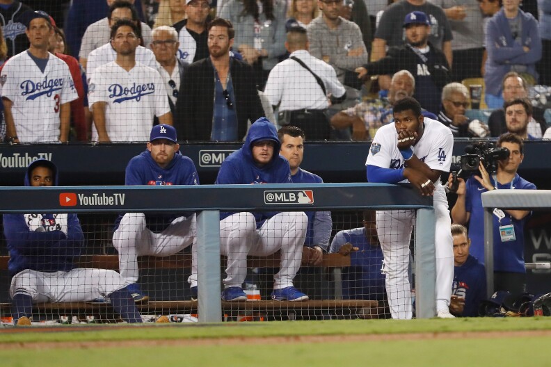 LOS ANGELES, CA - OCTOBER 28:  Yasiel Puig #66 of the Los Angeles Dodgers looks on from the dugout during the eighth inning against the Boston Red Sox in Game Five of the 2018 World Series at Dodger Stadium on October 28, 2018 in Los Angeles, California.  (Photo by Sean M. Haffey/Getty Images)