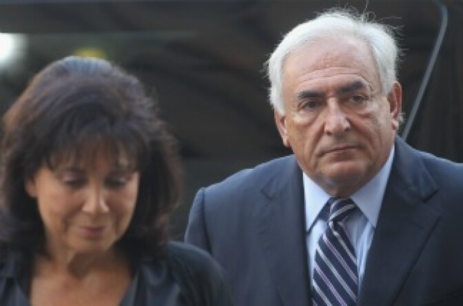 Former International Monetary Fund (IMF) director Dominique Strauss-Kahn enters Manhattan State Supreme Court with his wife Anne Sinclair.