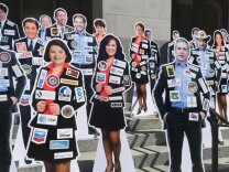 A proposed ballot initiative would require politicians to wear their top funders. 