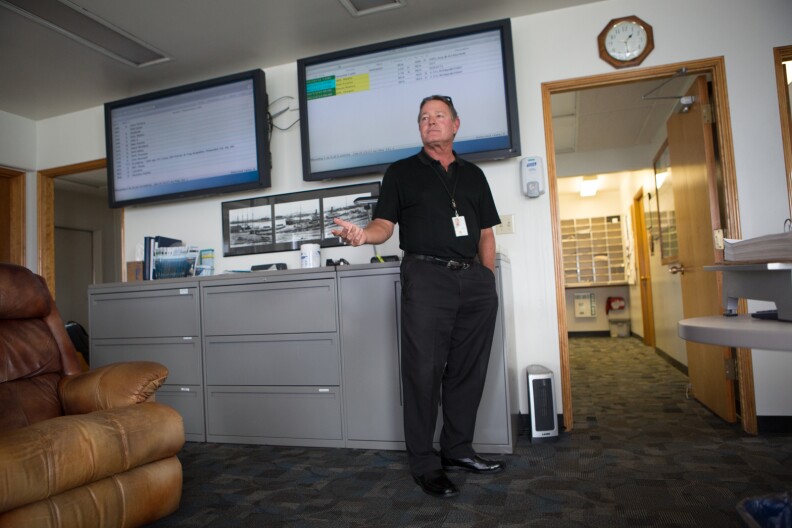 Port Pilot Brett McDaniel talks with colleagues before heading out to guide large vessels at The Port of Los Angeles.