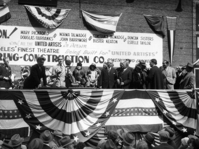 Ground breaking ceremony for the United Artists Theatre, looking toward the grand stand. Theater was built in 1927 and was part of the Texaco Building. 