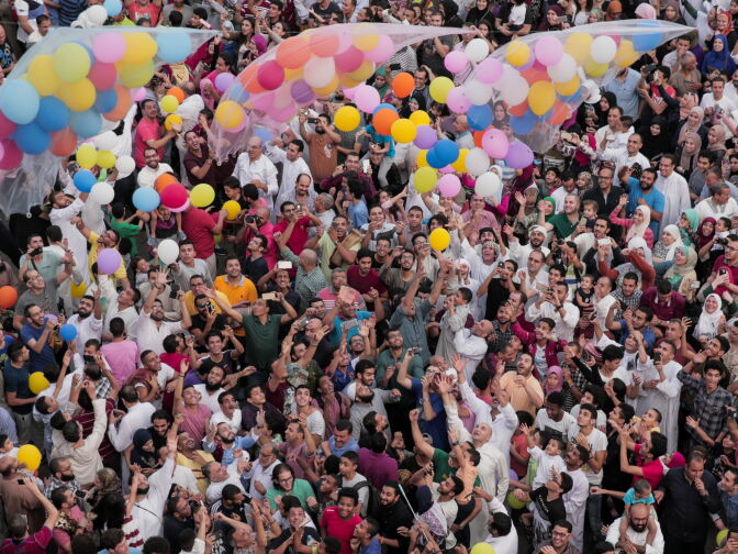 Egyptian Muslims release balloons at the end of prayers on the first day of Eid al-Fitr holiday that marks the end of the holy fasting month of Ramadan on June 25, 2017, in Cairo.  / AFP PHOTO / SAMER ABDULLAH        (Photo credit should read SAMER ABDULLAH/AFP/Getty Images)